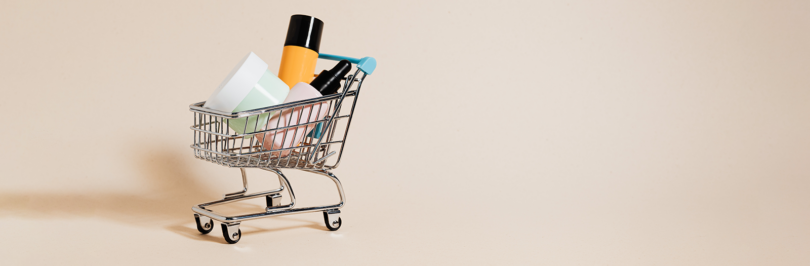 Empty beauty products in mini shopping cart